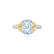 Engagement Ring with an Oval Diamond & Yellow Diamond Side Stones in Platinum & 18K Yellow Gold